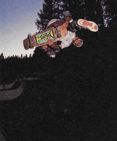 a man flying through the air while riding a skateboard