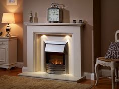 a living room with a fire place and a clock on the top of the fireplace