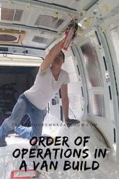 a man in the back of a van is holding up an object with words that read order of operations in a van build