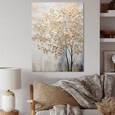 a living room scene with focus on the couch and painting hanging above it's head