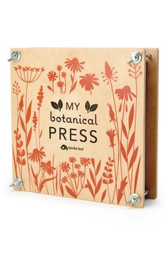 a wooden box with the words, my botanical press printed on it's side