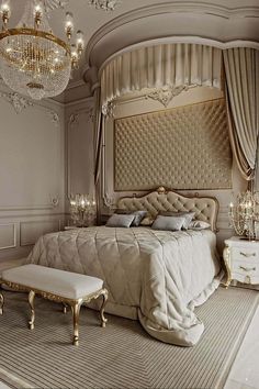 a luxurious bedroom with chandelier, bed and dressing table in the middle of the room