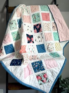 a quilted blanket sitting on top of a chair