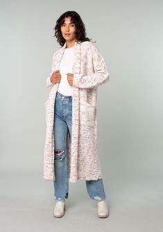 An ultra-cozy long shawl cardigan spun from a berry pink speckled knit. Speckled Oversize fit Long sleeve with cable knit accent Long duster length Shawl collar Side patch pockets Open front Cable knit accent along the back Bohemian long cardigan Laid-back and slouchy yet effortlessly polished, this ultra-soft duster cardigan is knit from a berry pink speckled yarn. Featuring classic cable knit details along the back and essential side pockets. The shawl collar adds warmth and coziness. Model is Cozy Shawl Collar Cardigan For Loungewear, Pink Textured Knit Outerwear For Spring, Spring Pink Textured Knit Outerwear, Knitted Cozy Fit Outerwear For Loungewear, Cozy Fit Knitted Outerwear For Loungewear, Spring Knit Sweater Coat For Loungewear, Cable Knit Sweater Coat For Spring Cold Weather, Cable Knit Sweater Coat For Cold Spring Weather, Knit Sweater Coat With Pockets For Loungewear