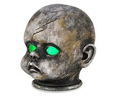 a creepy looking head with green eyes on a white background for decoration or halloween decorations