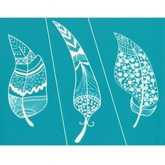 three feathers with designs on them sitting in front of a blue background