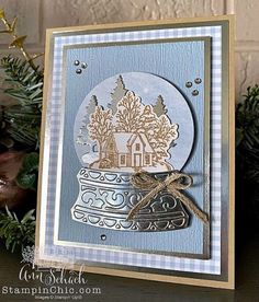 a christmas card with an image of a house in a pot