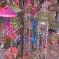 there are many jellyfishs and other sea creatures in this shop window display,