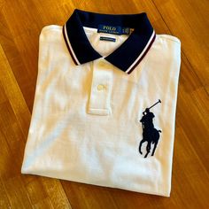 White Polo With Blue Collar, Blue Trimmed Sleeves, And A Big Blue Pony Logo On Left Chest. Custom Slim Fit. Nwt Mint Condition. Nh5fe4x4sa3s Red Polo Shirt, Polo Shirt Colors, Polo Pullover, Polo Ralph Lauren Shorts, Lauren Brown, Thermal Shirt, Ralph Lauren Shorts, Lauren Green, Ralph Lauren Polo Shirts