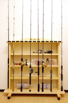 there are many fishing rods on the shelf