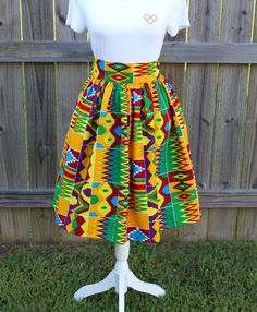 Beautiful Handmade 100% cotton African Maxi Skirt in a gorgeous vibrant 100% cotton African print with 2 1/2 inch high waistband. Made to order, please measure your waist for a perfect fit. Features: Knee Length 24 inches Maxi Length 42 inches * Lined * 2 Side Pockets * Back zip closure Important info on sizing: All items are created custom to your measurements. Fit is very important for these skirts to fit correctly so I will need your natural waist measurement. This is taken above the belly bu Casual Printed Cotton Skirt, Casual Multicolor Cotton Skirt, Vibrant Cotton Skirt For Summer, Vibrant Multicolor Cotton Bottoms, Traditional Full Skirt Cotton Skirt, Traditional Yellow Cotton Bottoms, Colorful Bohemian Cotton Skirt, Multicolor Cotton Full Skirt, Green Full Cotton Skirt