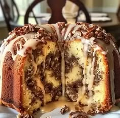 a bundt cake with icing drizzled over it on a plate