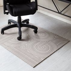 an office chair sitting on top of a rug