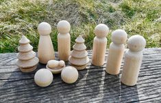 a group of wooden pegs sitting on top of a table next to each other