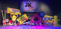 various candy and candies are displayed on a stage