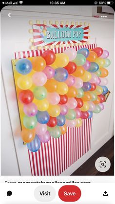 a balloon pop sign hanging from the side of a door