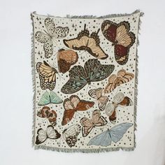 a wall hanging with many butterflies on it