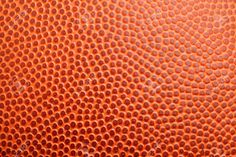 an orange basketball textured with small holes