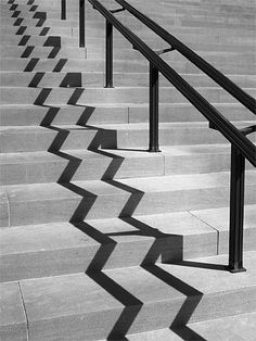 black and white photograph of stairs with railings