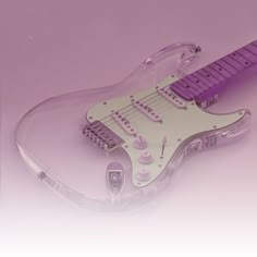 an electric guitar shaped like a heart on a purple background with text overlaying the image