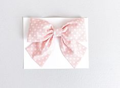 This adorable blush polka dot bow from Simply Ellie is perfect for spring or summer. This is our larger design for older girls and for girls with more hair! Cute Pink Summer Bow, Pink Bow Gift For Spring, Cute Satin Bow For Spring, Playful Pink Satin Bow, Cute Adjustable Bow For Spring, Playful Adjustable Bow For Spring, Cute Spring Bow For Gift, Cute Adjustable Bow For Summer, Adjustable Playful Pink Bow