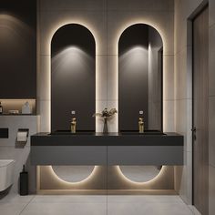 a modern bathroom with two sinks and mirrors