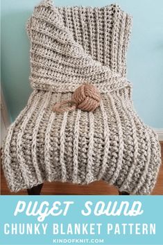 a chunky blanket is sitting on top of a chair with the words, pugt sound chunky blanket pattern