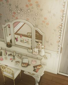 a desk and chair in a room with floral wallpaper on the walls behind it