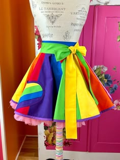 Hi! This cute colorful costume rainbow apron is perfect for Pride, CircusCore and Clowncore cosplay, or every day cuteness 🌈 Includes the trans pride flag colors as well.🏳️⚧️ ❤️ Entirely made from repurposed scraps from my fabric stash, making this a sustainable fashion choice. ❤️ This is an apron that ties in the back, it will be open in the back, unless you choose the wrap skirt option, where I can add extra fabrics to be able to wrap and cover the opening. I love the rainbow effect on this apron. I use high-quality Kona cotton fabric here, the best you can get. I also used scraps of bias tape trim, so everything is super colorful and rainbow-y. This apron is fully lined in surprise colorful fabric, I never know what fabric I will use for the lining! LGBTQ Pride! This is cute for a Pri Sustainability Fashion, Rainbow Clothes, Cute Costumes For Women, Rainbowcore Fashion, Trans Pride Flag, Apron Tutorial, Pride Flag Colors, Trans Pride, Rainbow Outfit