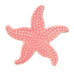 a pink starfish with white dots on it's body and back side, against a white background