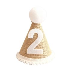 a party hat with the number two on it's side and a white ball at the top