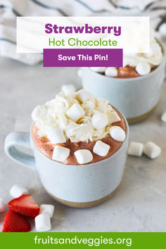 two cups filled with hot chocolate and marshmallows on top of each other