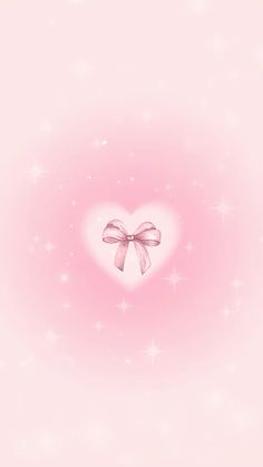 a pink heart with a bow on it's side and stars in the background