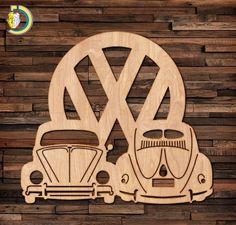 a wooden cutout of two vw buggies