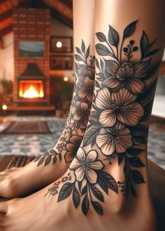 a woman's legs with flowers and leaves on them