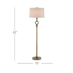 the floor lamp has a white shade on it and is shown with measurements for the base