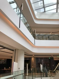 the inside of a building with glass balconies