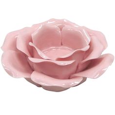 a pink ceramic flower on a white background