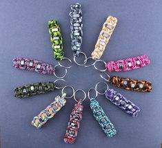 a bunch of different colored bracelets sitting in a circle on top of a table