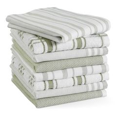 stack of folded towels in white and green colors on top of each other, isolated against a white background