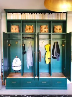 a green cabinet with some clothes hanging on it