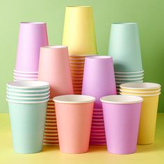 many different colored cups stacked on top of each other