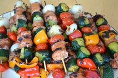 several skewers of different vegetables on a plate