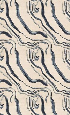 an area rug with wavy lines on it