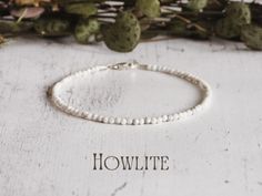 Howlite is the '𝗦𝘁𝗼𝗻𝗲 𝗼𝗳 𝗣𝗮𝘁𝗶𝗲𝗻𝗰𝗲' and is said to have the following properties: * Aids patience and focus * Boosts inspiration and creativity * Calms an overactive mind  * Improves memory Delicately designed with a minimalist touch, these bracelets feature dainty 2mm faceted beads that exude a subtle yet captivating sparkle. Each piece is meticulously threaded on durable wire, ensuring resilience for everyday wear, while sterling silver clasps add a touch of elegance and secure c Custom Jewellery, Bracelet Minimalist, Bracelet Stack, Faceted Bead, Gemstone Bracelet, Silver Charms, Arm Band, Custom Jewelry, Crystal Healing