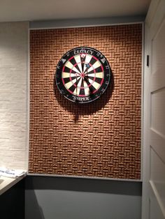 a dart board mounted to the side of a wall