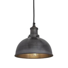 an industrial style pendant light hanging from the ceiling