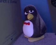 a penguin with a bow tie standing in front of a blue wall and the words children's room written on it