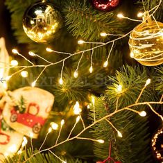 a christmas tree with ornaments and lights on it