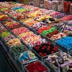 many different colored candies are on display